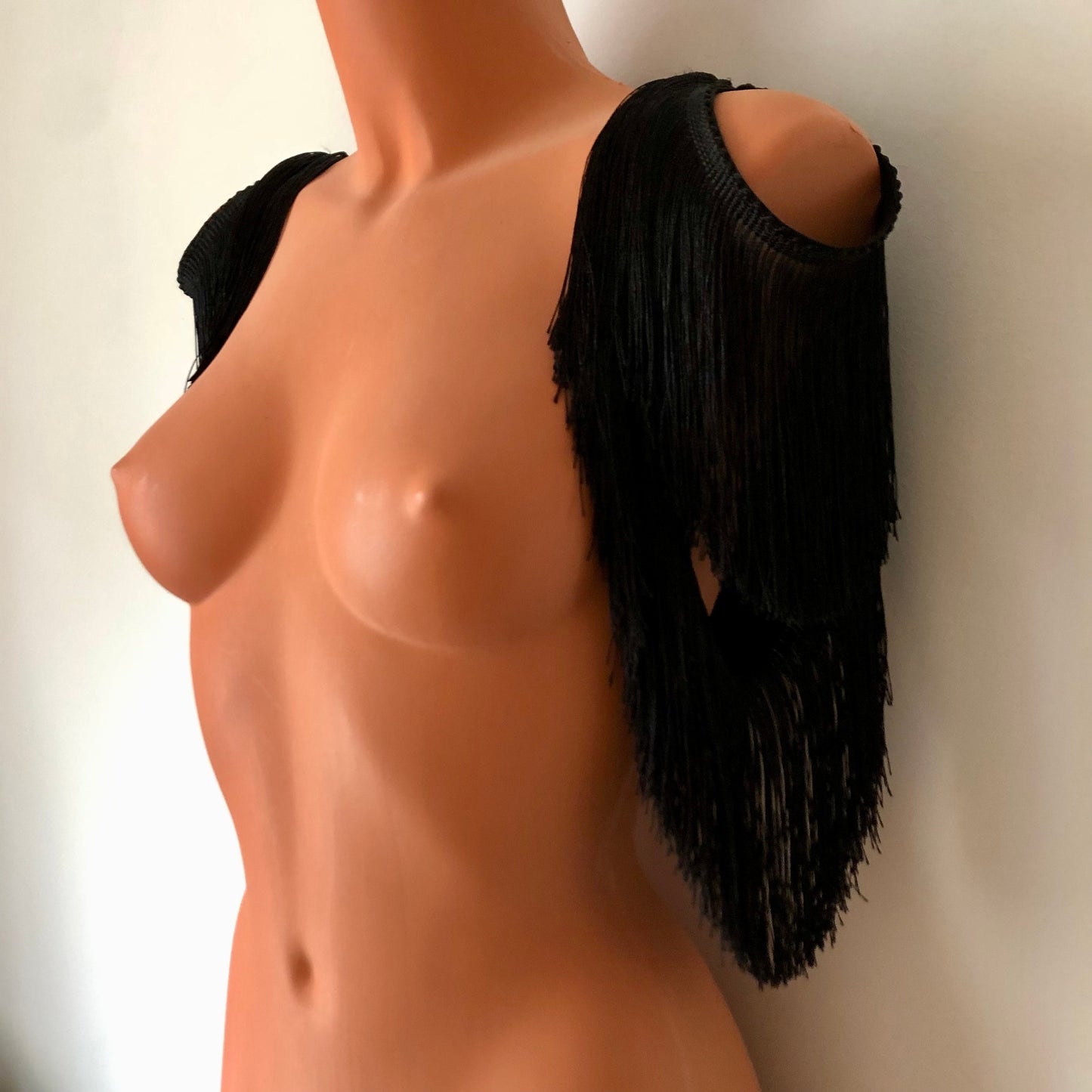 Black shimmy fringe shrug bolero capelet on a mannequin - front diagonal