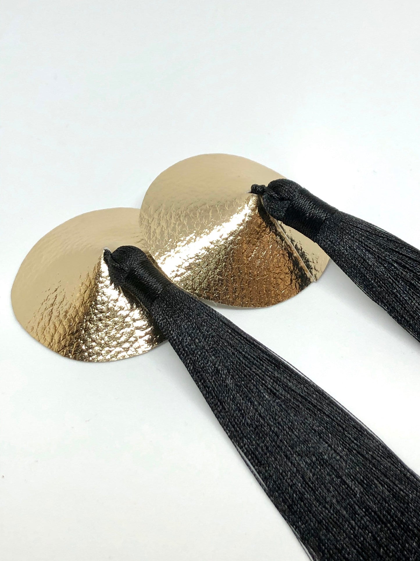 Gold faux leather burlesque pasties nipple covers with thick and long black silk tassels