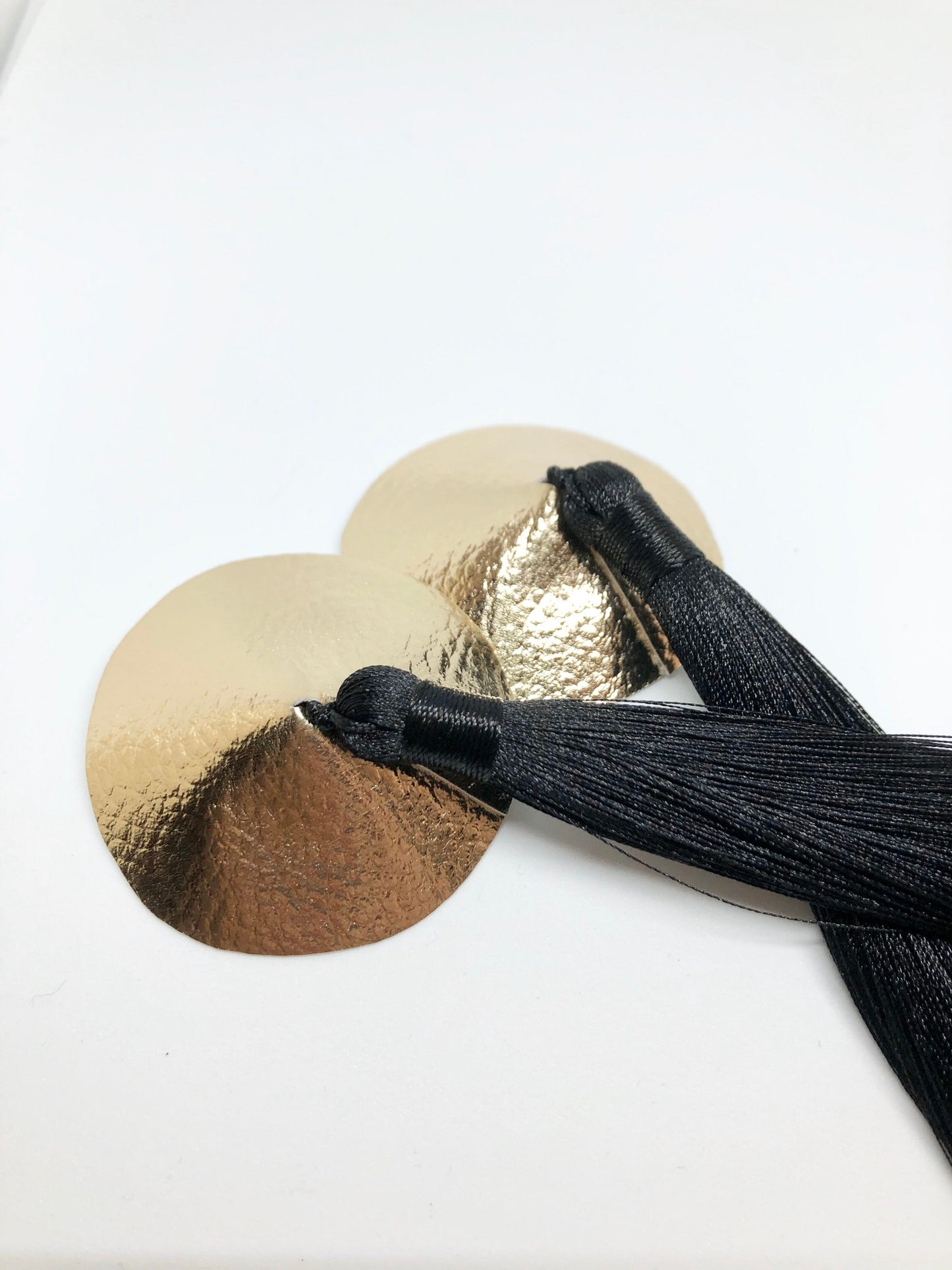 Gold faux leather burlesque pasties nipple covers with thick and long black silk tassels