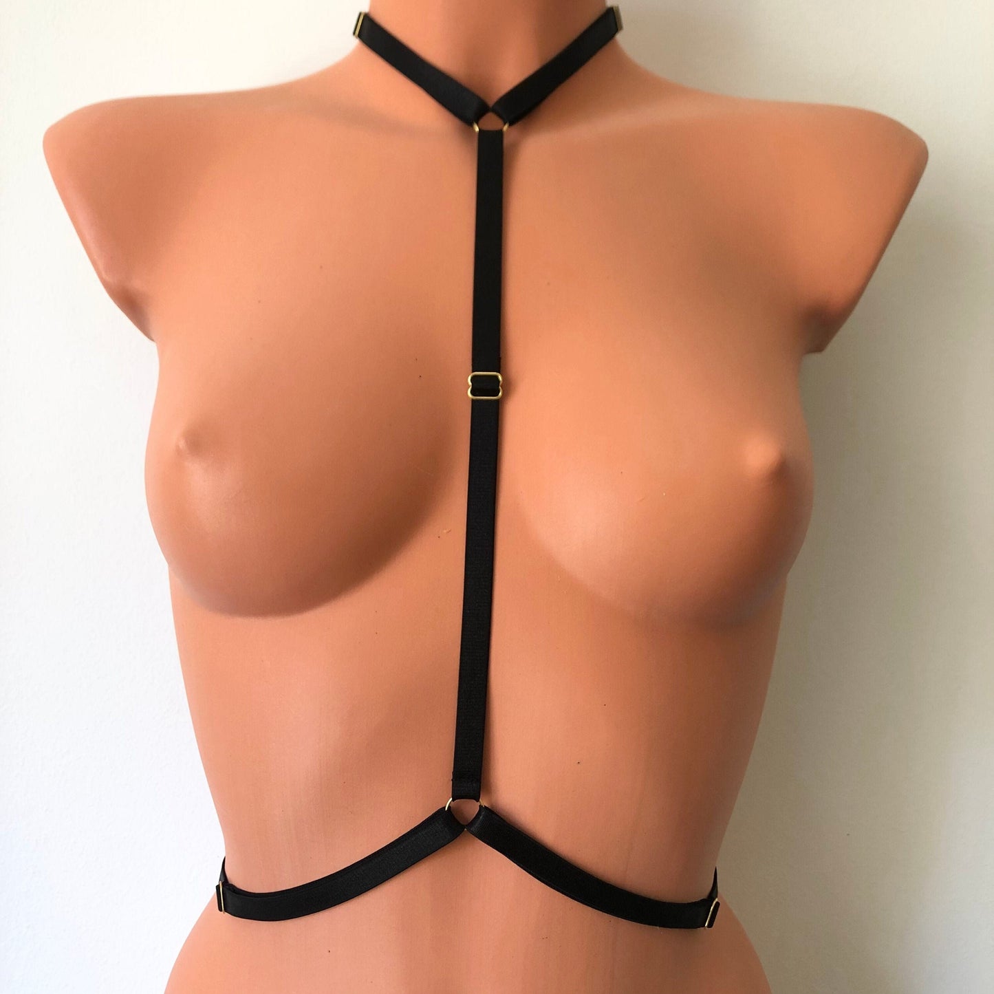 An elastic chest harness on a mannequin - front