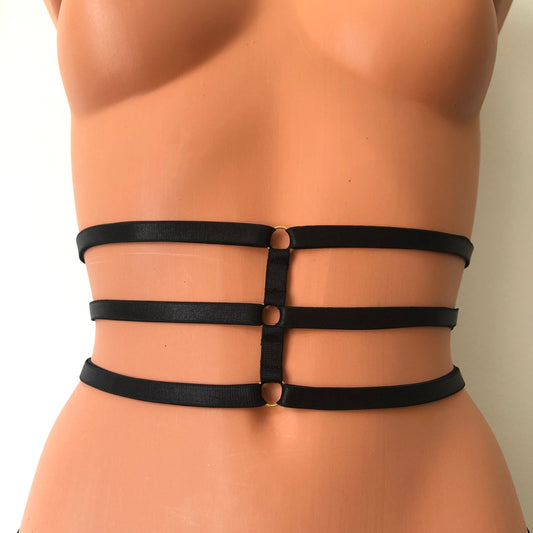 Black elastic waist cage harness on a mannequin - back