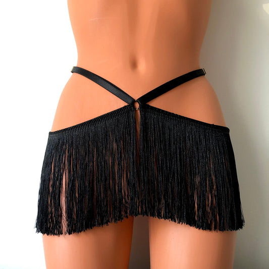 Black shimmy fringe waist harness belt skirt on a mannequin - front