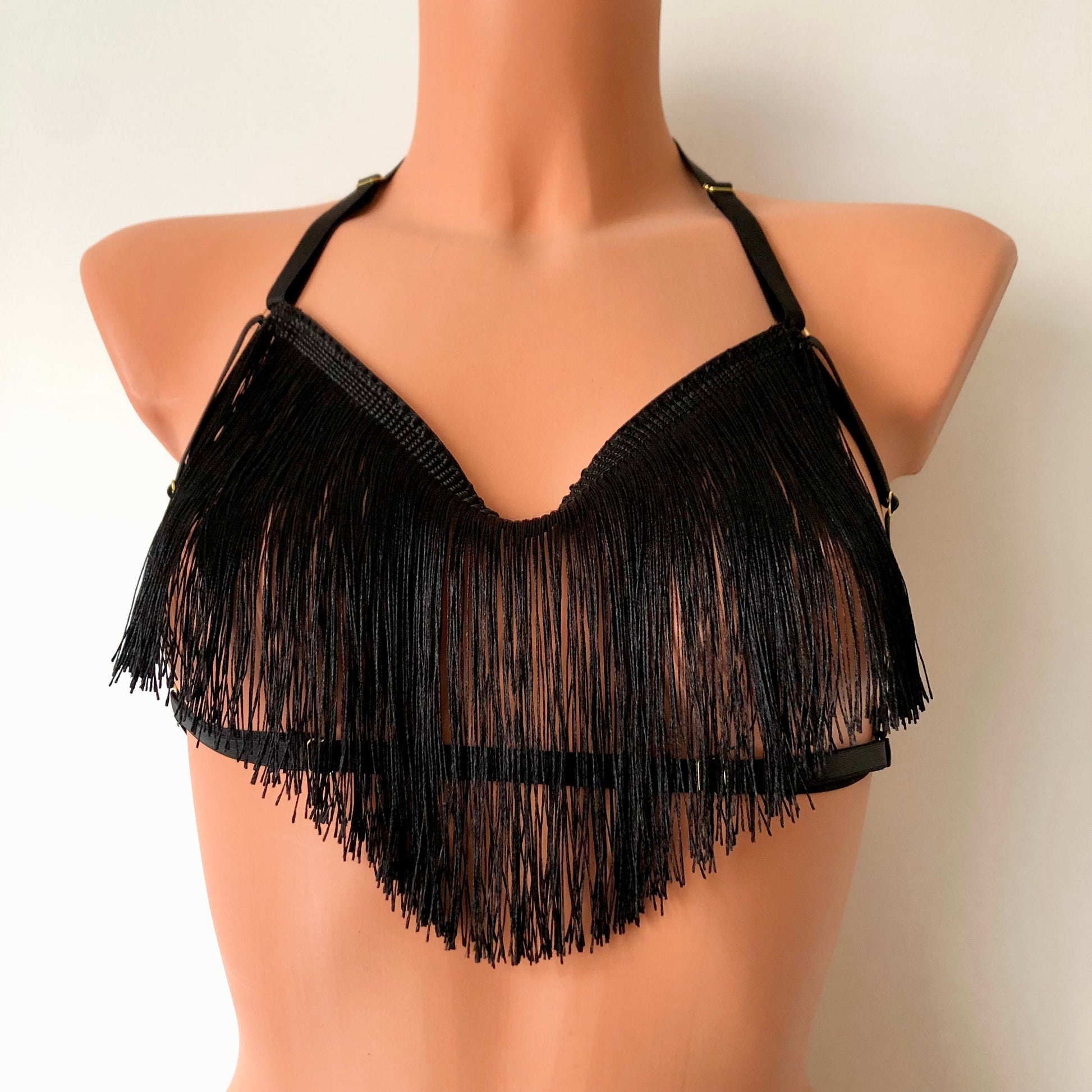 Black shimmy fringe draped halter bra on a mannequin - front