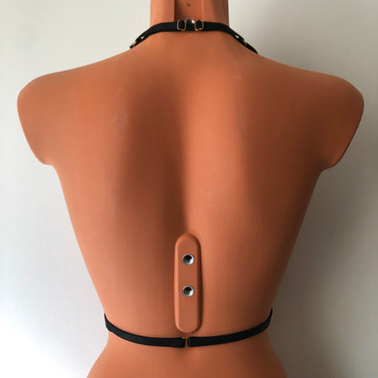 Black shimmy fringe chest harness on a mannequin - back