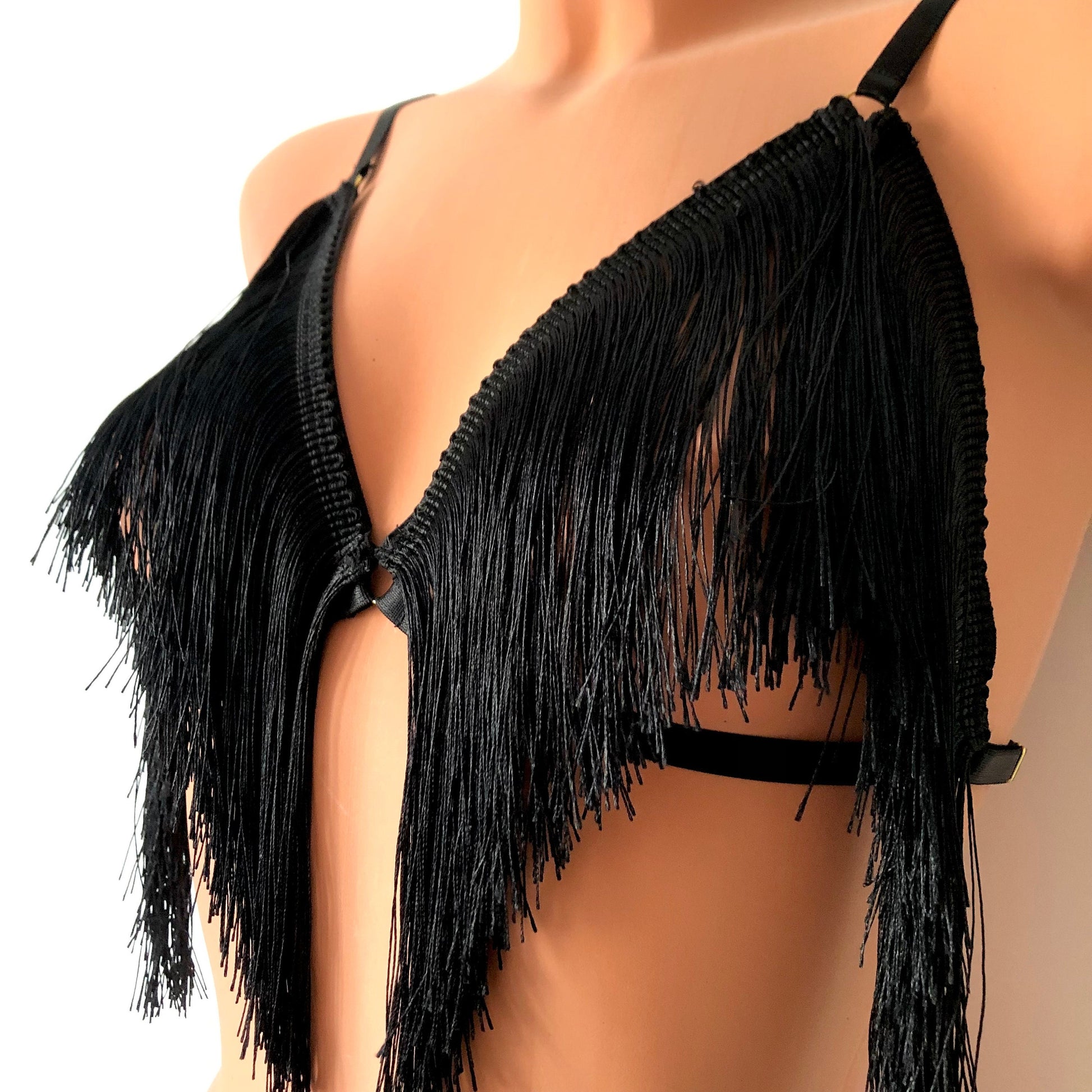 Black shimmy fringe cupless bra on a mannequin - front diagonal
